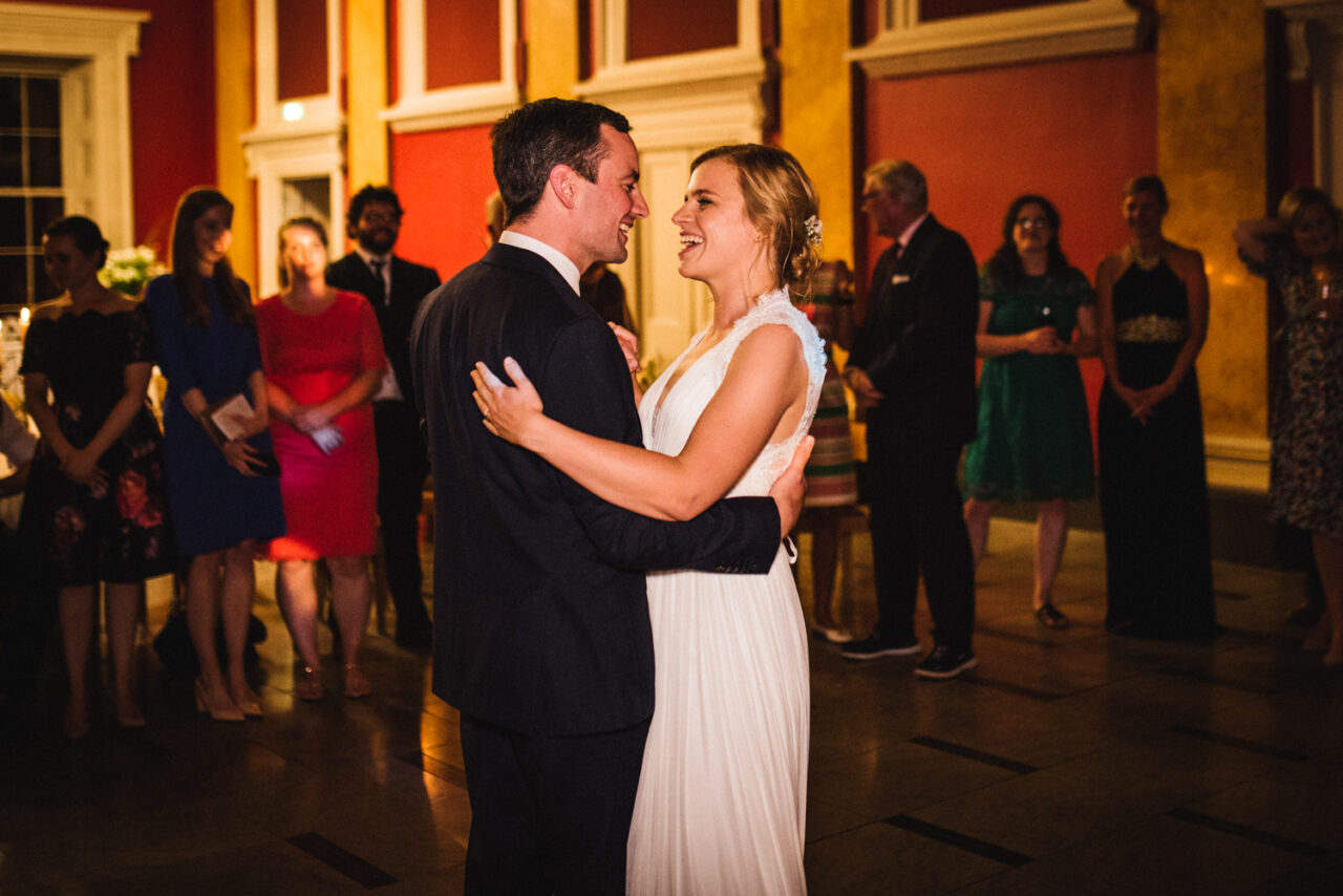 The bride and groom dance at their wedding reception at Downing College in Cambridge.