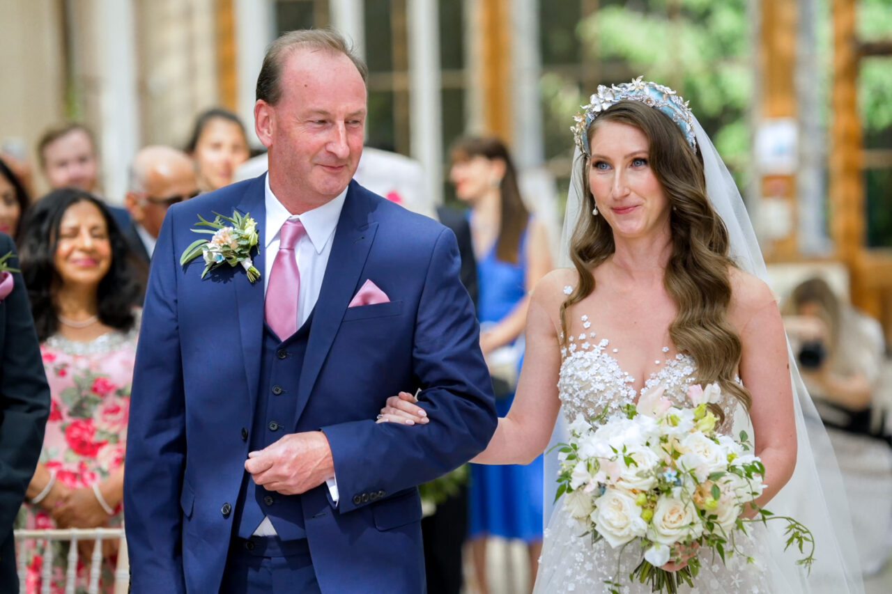 Kew Gardens Wedding Photos - The bride and her father walk down the aisle at the start of the wedding ceremony in the Nash Conservatory.