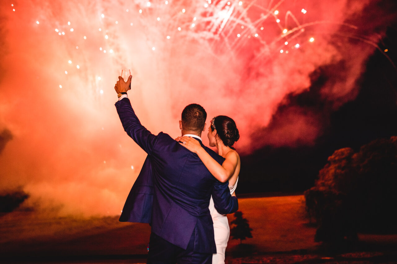 Wynyard Hall Wedding Photographer - A bride and groom celebrate with fireworks on their wedding day.