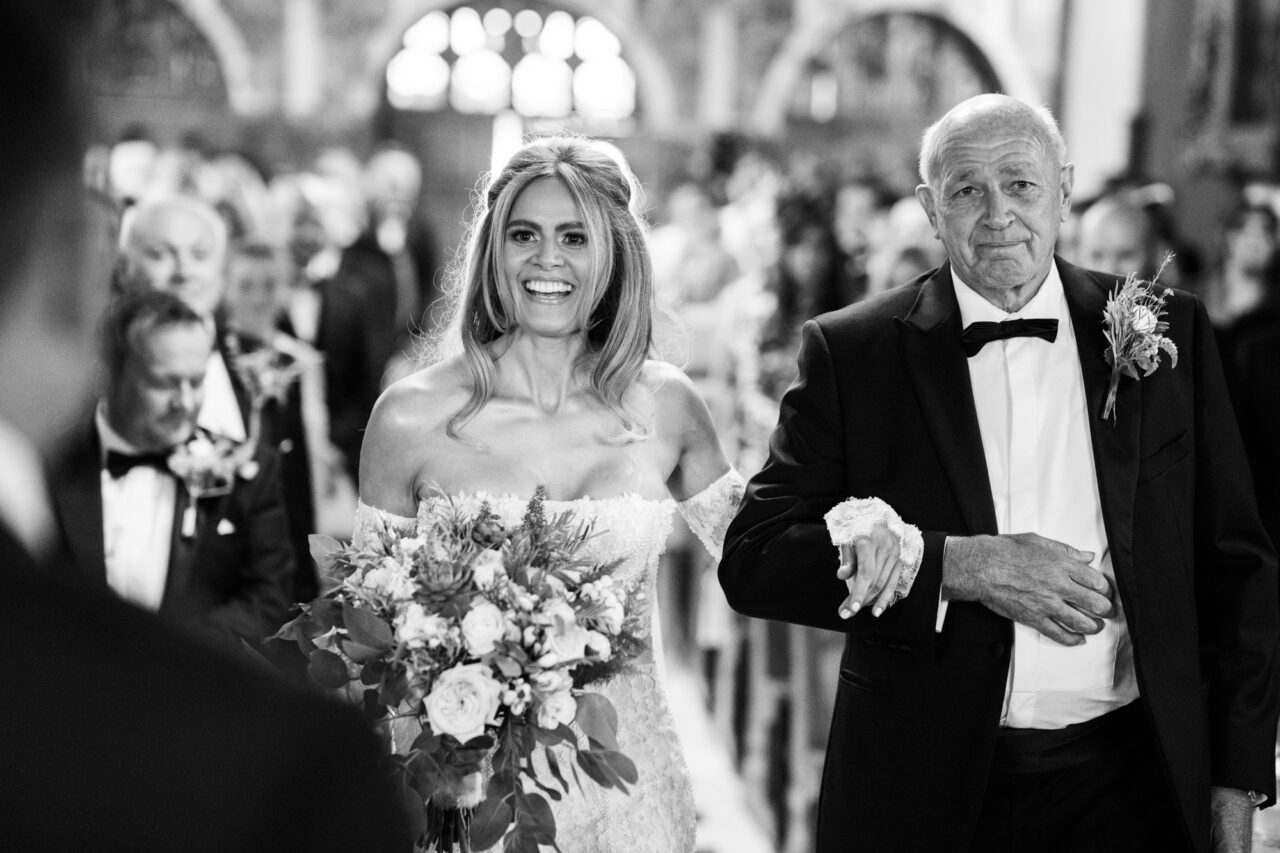 Wynyard Hall Wedding Photographer - A bride and her father walk down the aisle in the chapel on the Wynyard Estate.