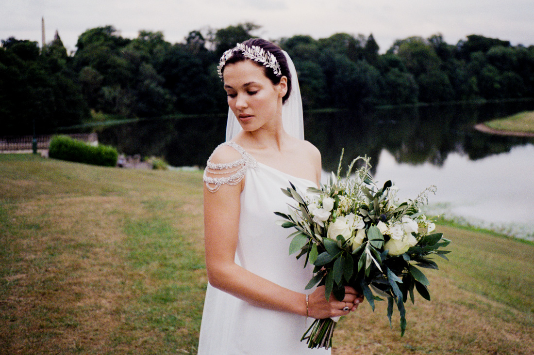 Wynyard Hall Wedding Photographer. A bride poses with flowers at Wynyard Hall.