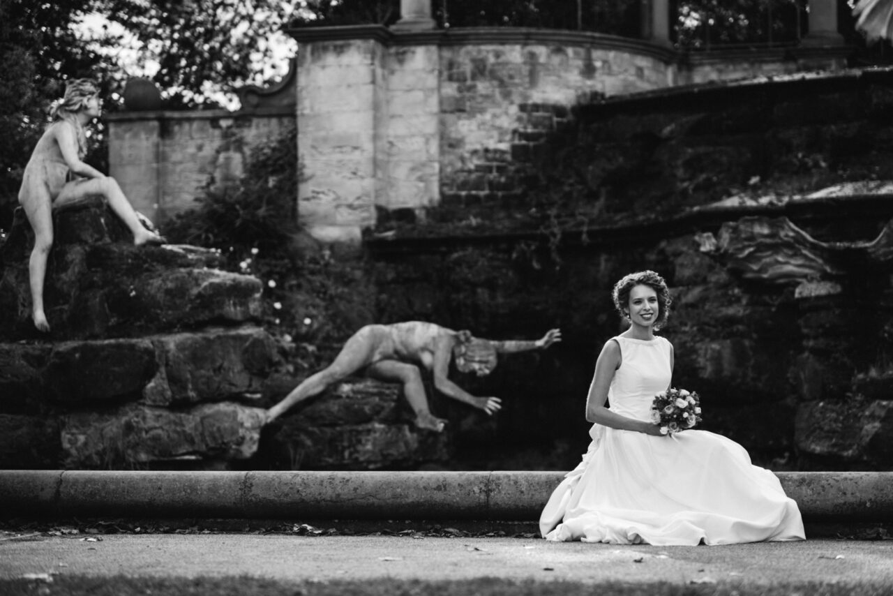 Bride in a park on her wedding day in Richmond.