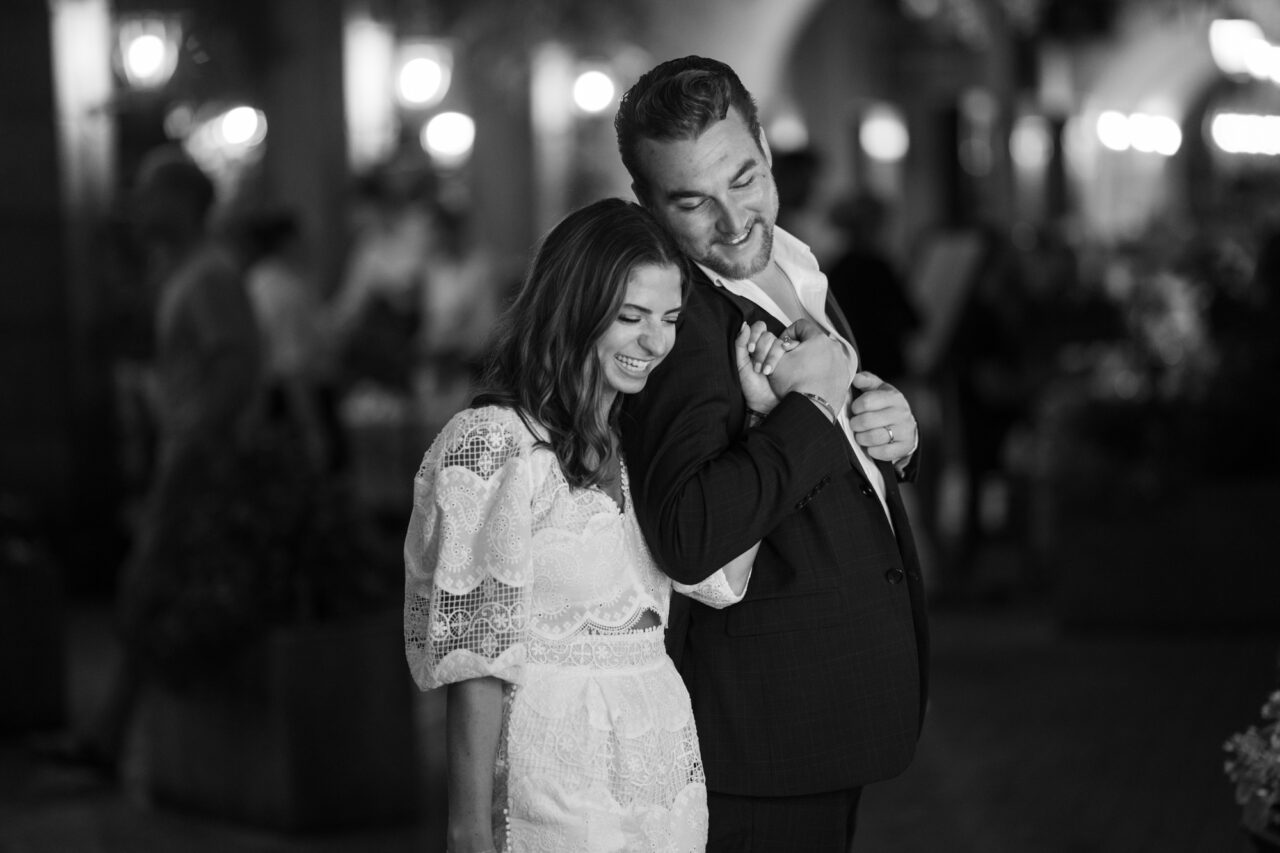 Bride and groom laughing in the streets after their Lake Como elopement.