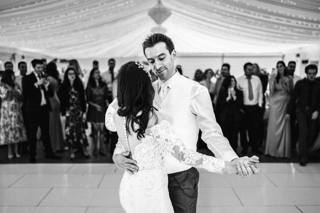 A bride and groom dancing their first dance.