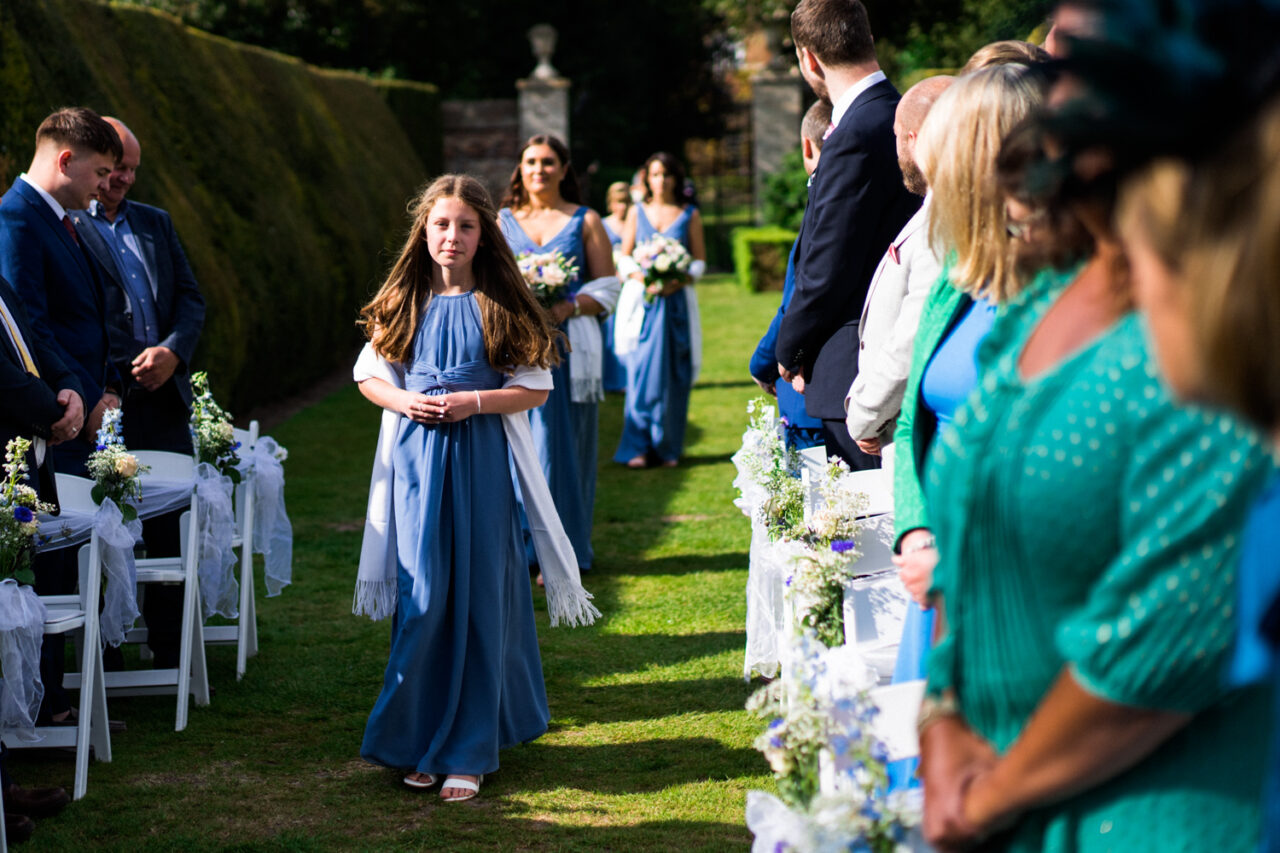 Hockwold Hall wedding photo of bridesmaids walking down the aisle