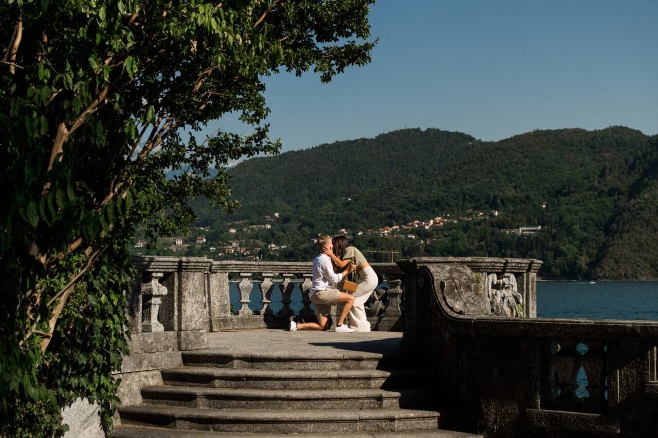 Lake Como Proposal Photography in Tremezzo - A man proposes to his girlfriend.