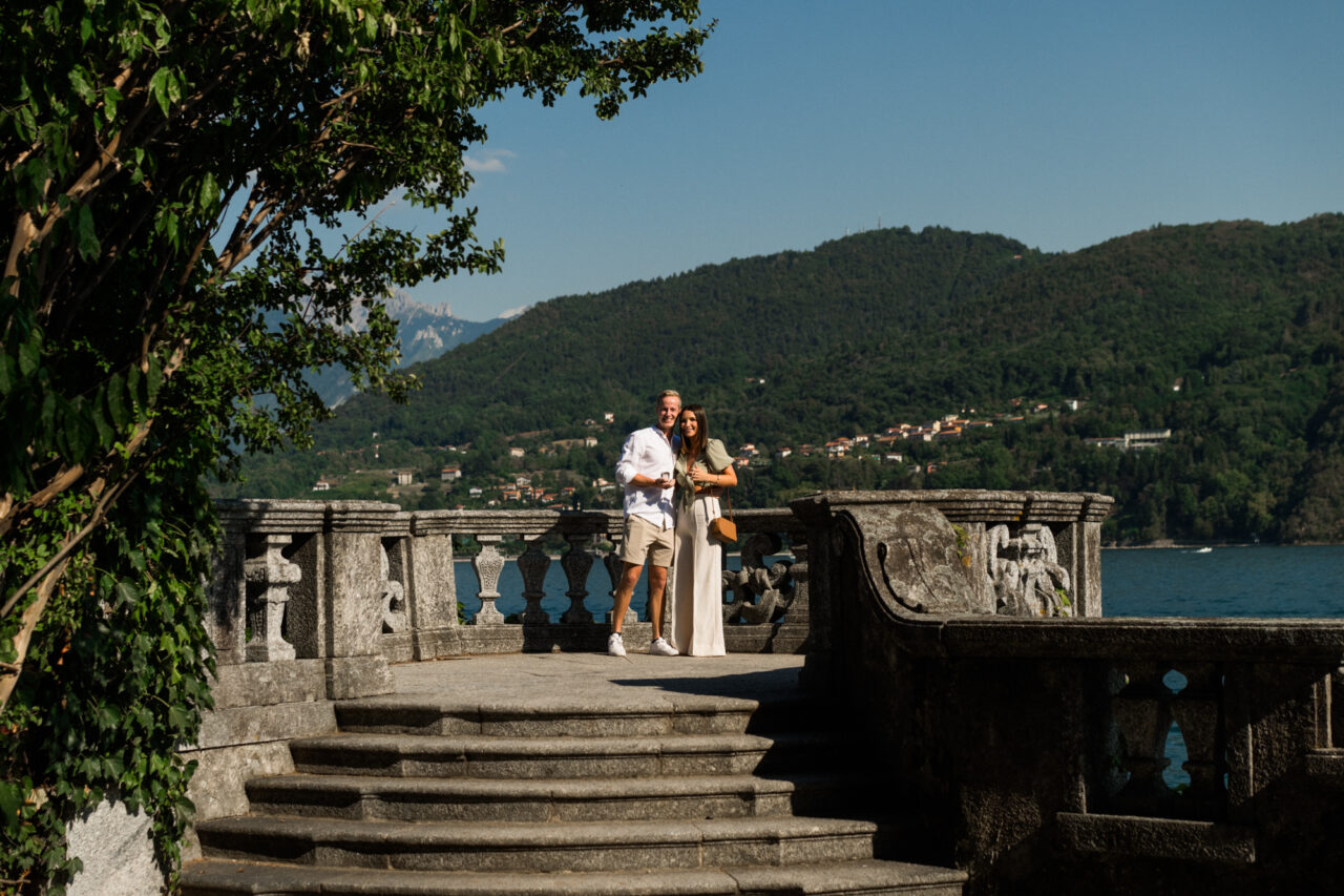 Lake Como Proposal Photography in Tremezzo - A man proposes to his girlfriend near the lake.