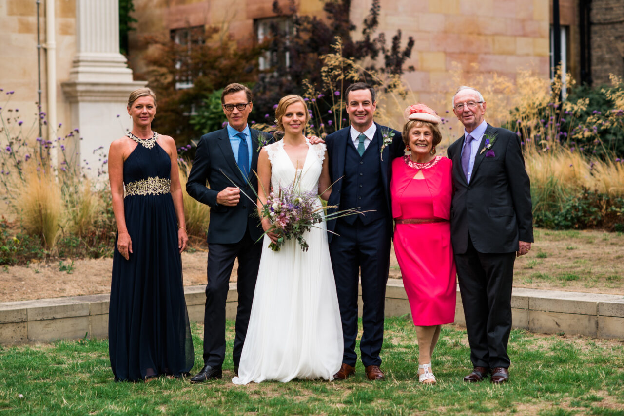 Family wedding photo of 6 people.