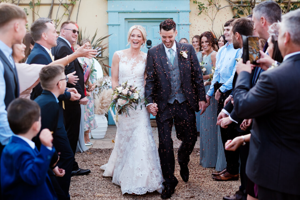 Confetti is thrown at a newly married couple at South Farm.