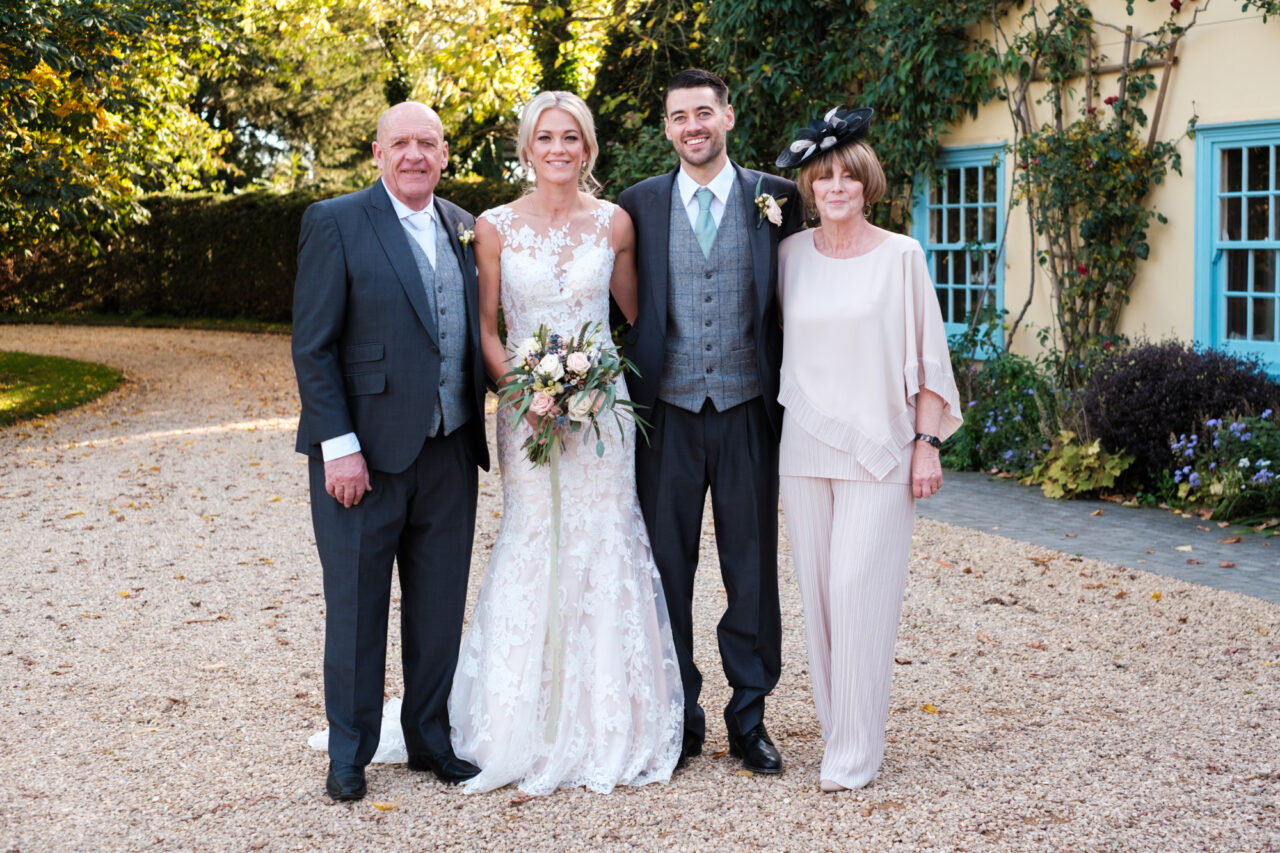 South Farm Wedding Photography - An family photo outside the house.