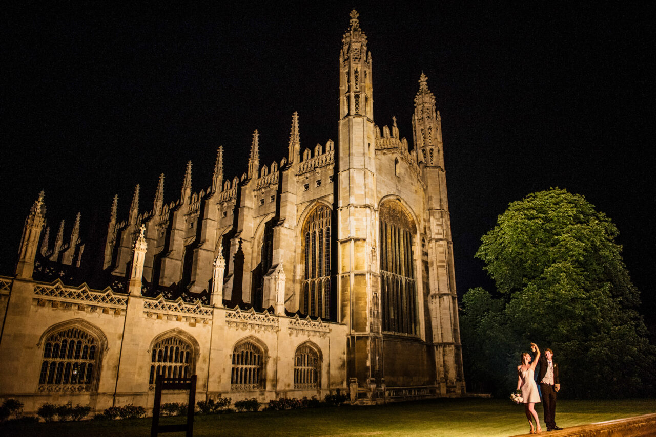 A couple dance on King's Parade with King's College Chapel in the background.