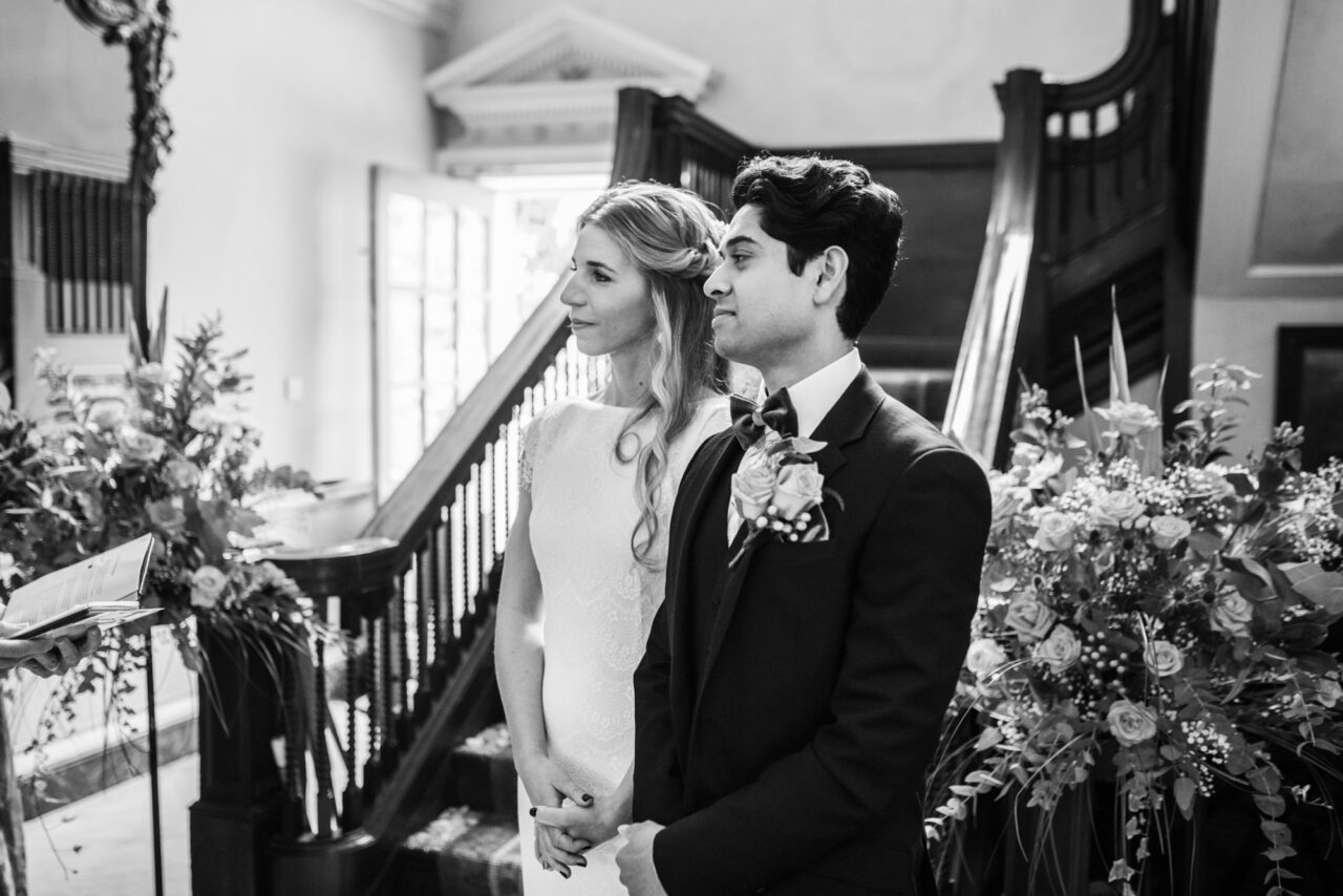 A bride and groom pictured during their wedding ceremony at Island Hall in Godmanchester.