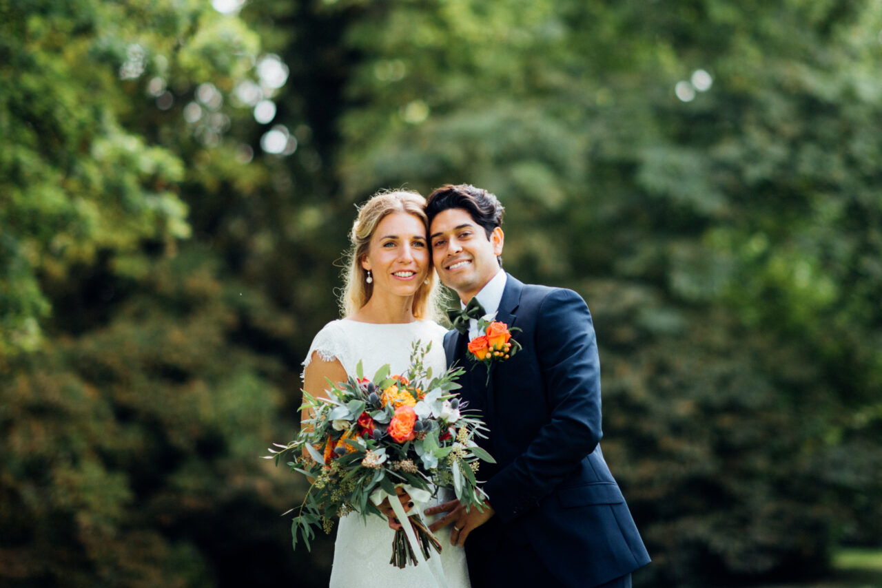 A bride and groom pictured in the garden at Island Hall in Godmanchester.