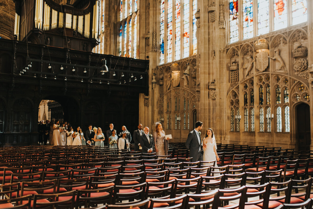 A wedding procession out of King's College chapel.