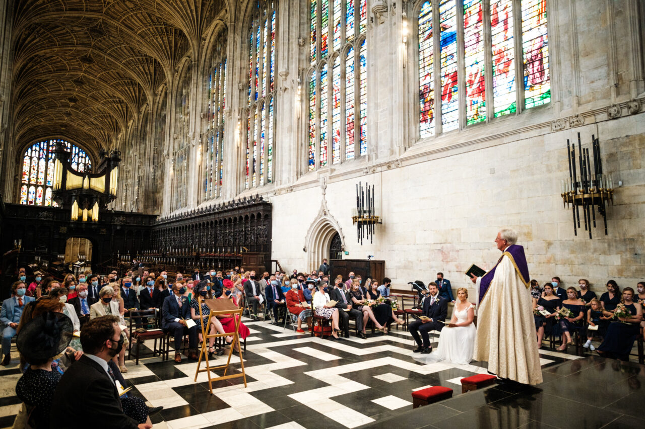 A wide view of a wedding service in King's College Chapel in Cambridge.