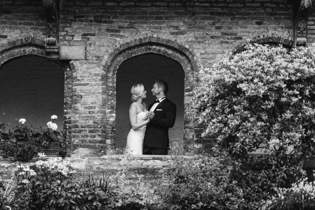 Bride and groom in the closiers in Queens' College.