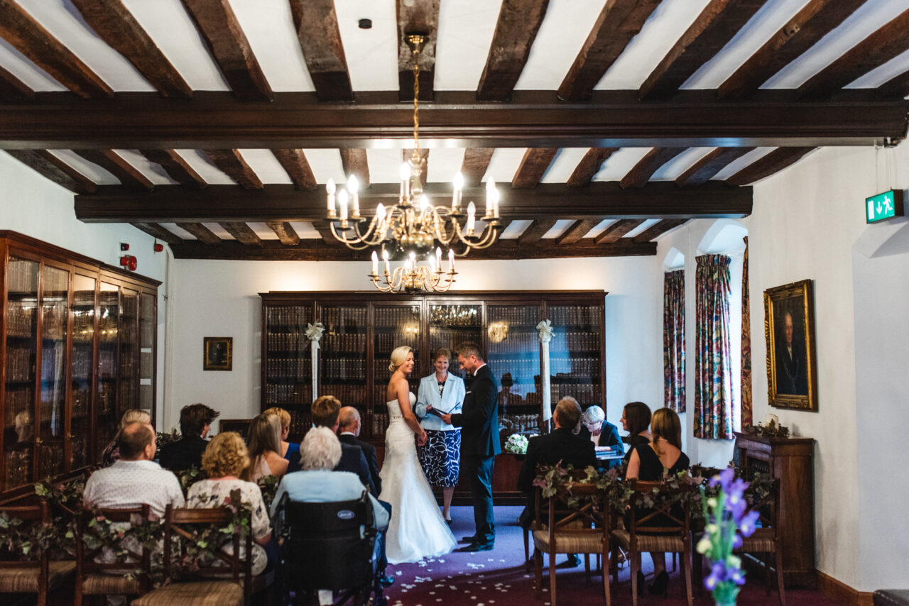 Wedding ceremony in The Munro Room at Queens' College in Cambridge.