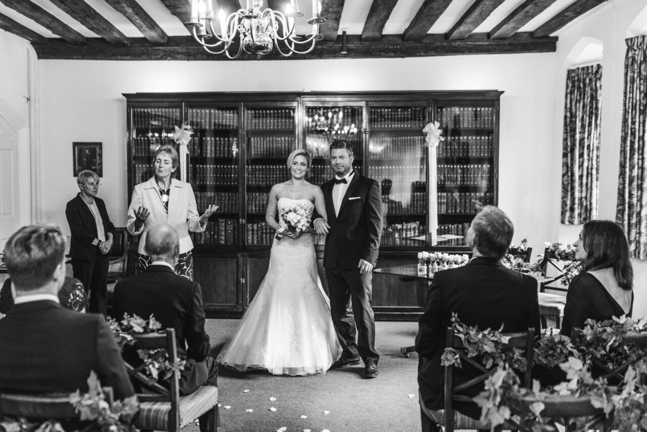 Wedding ceremony in The Munro Room at Queens' College in Cambridge.