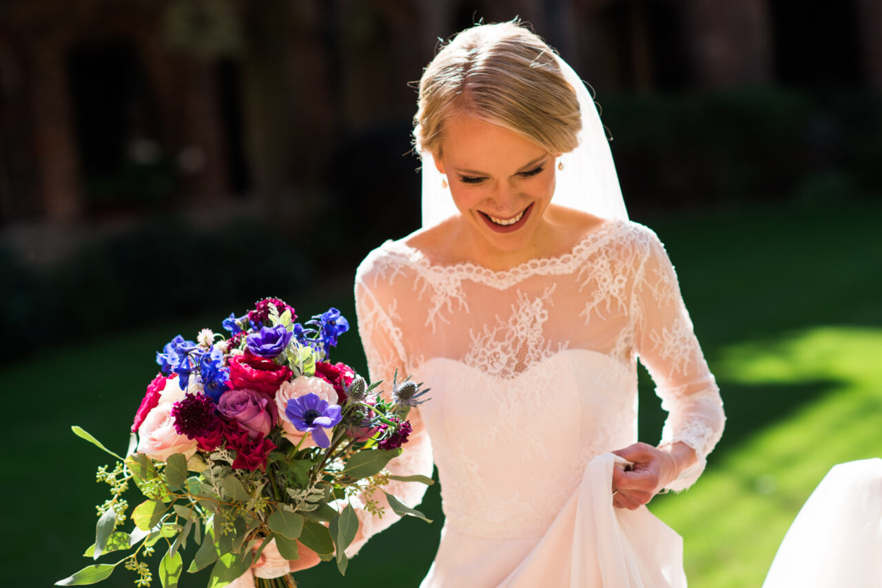 Bride in the sunshine in Queens' College.