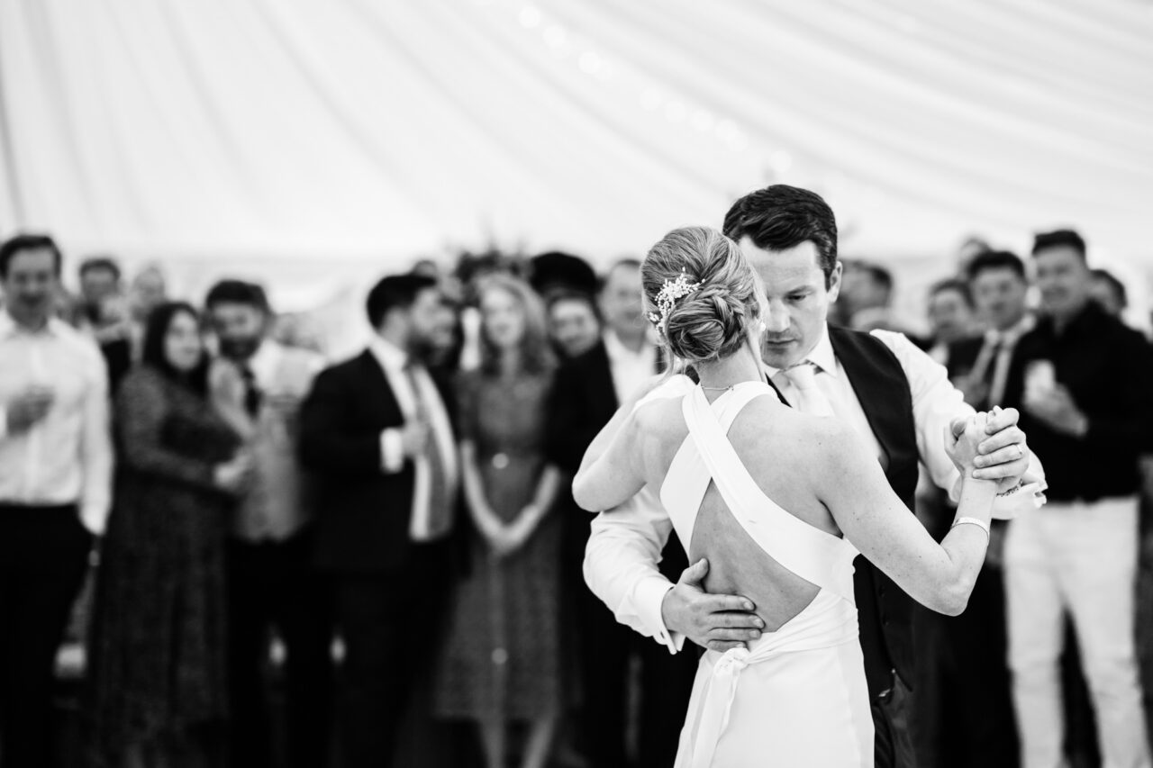 A couple dance their first dance.