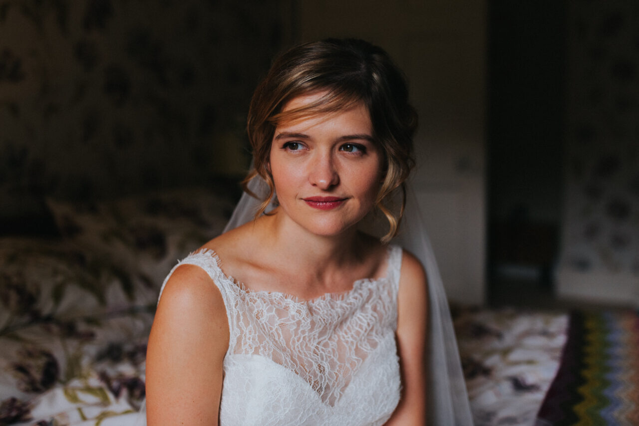 A very serene, natural portrait of a bride in soft window light.