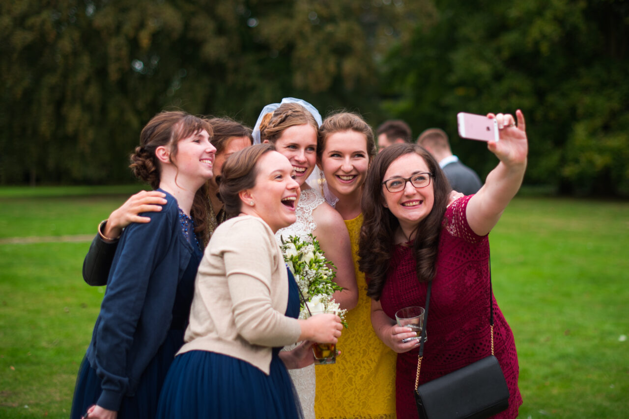 Swynford Manor Wedding - guests take a selfie with the bride.