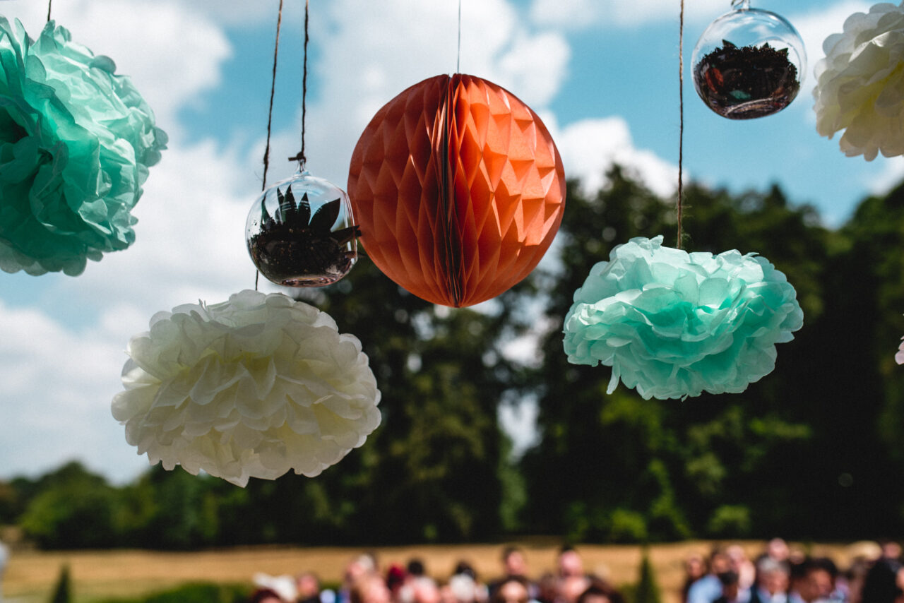 Paper wedding decorations hanging from the wooden pergoda at Swynford Manor.