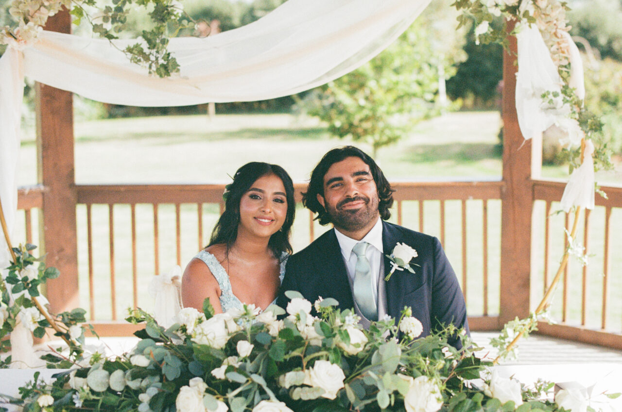 Analogue wedding photo of a bride and groom at their ceremony.