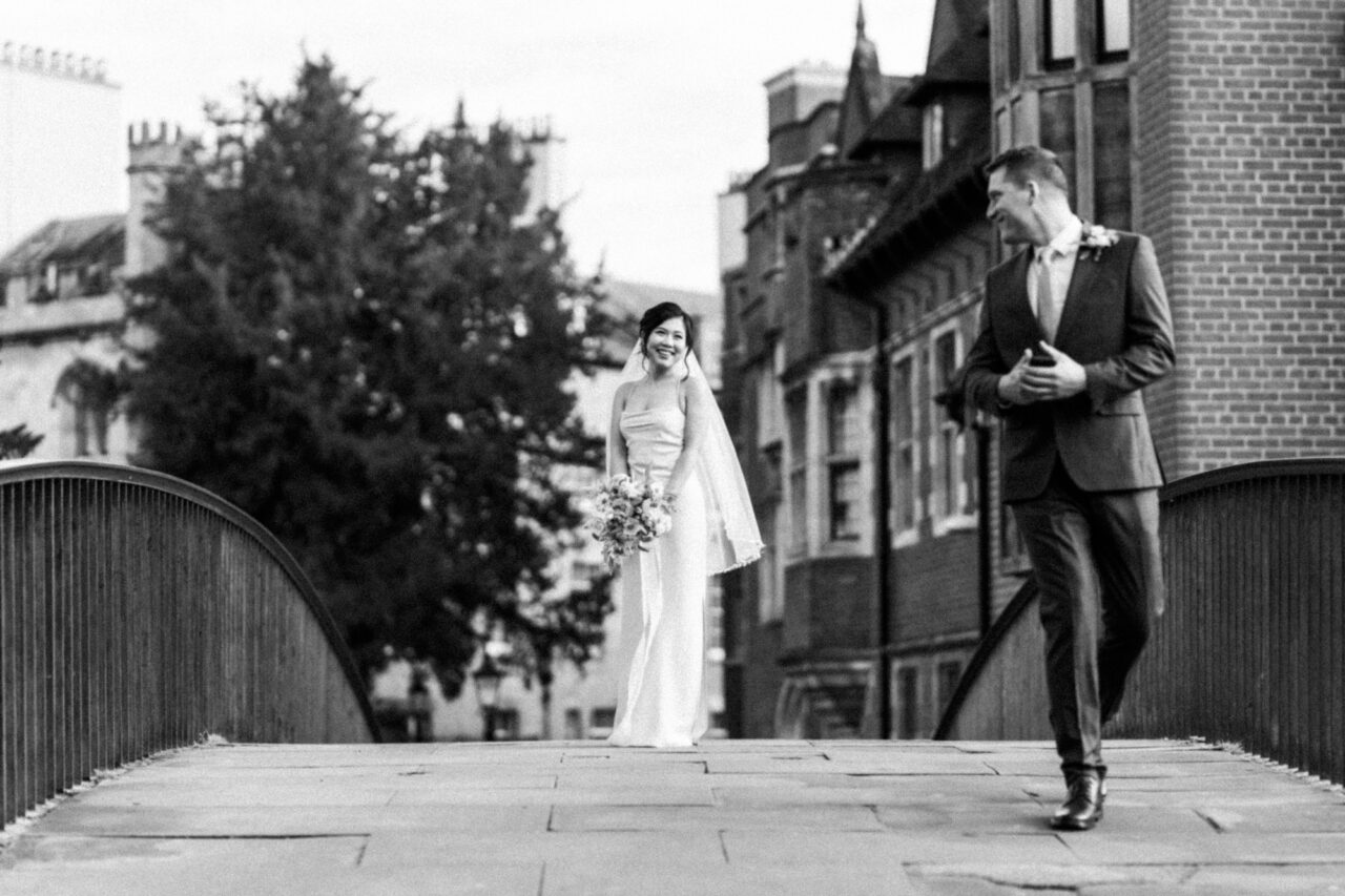 Bride and groom on Garret Hostel Bridge in Cambridge.