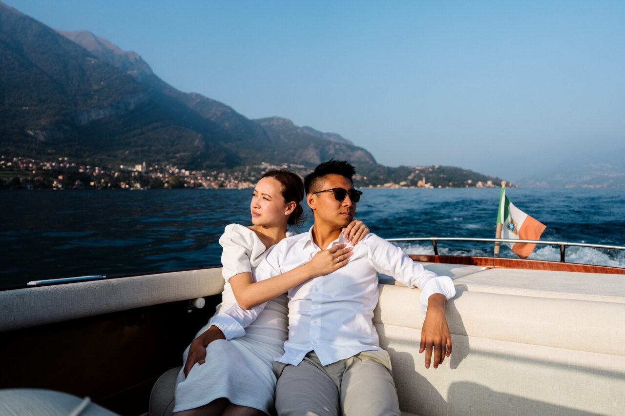 A couple on a boat on Lake Como in Italy.