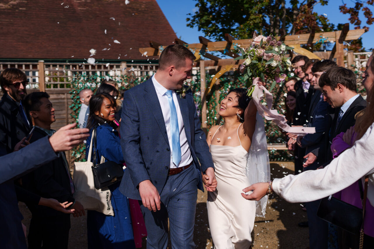 Confetti is thrown on a couple at Cambridge Registry Office on Ascham Road.