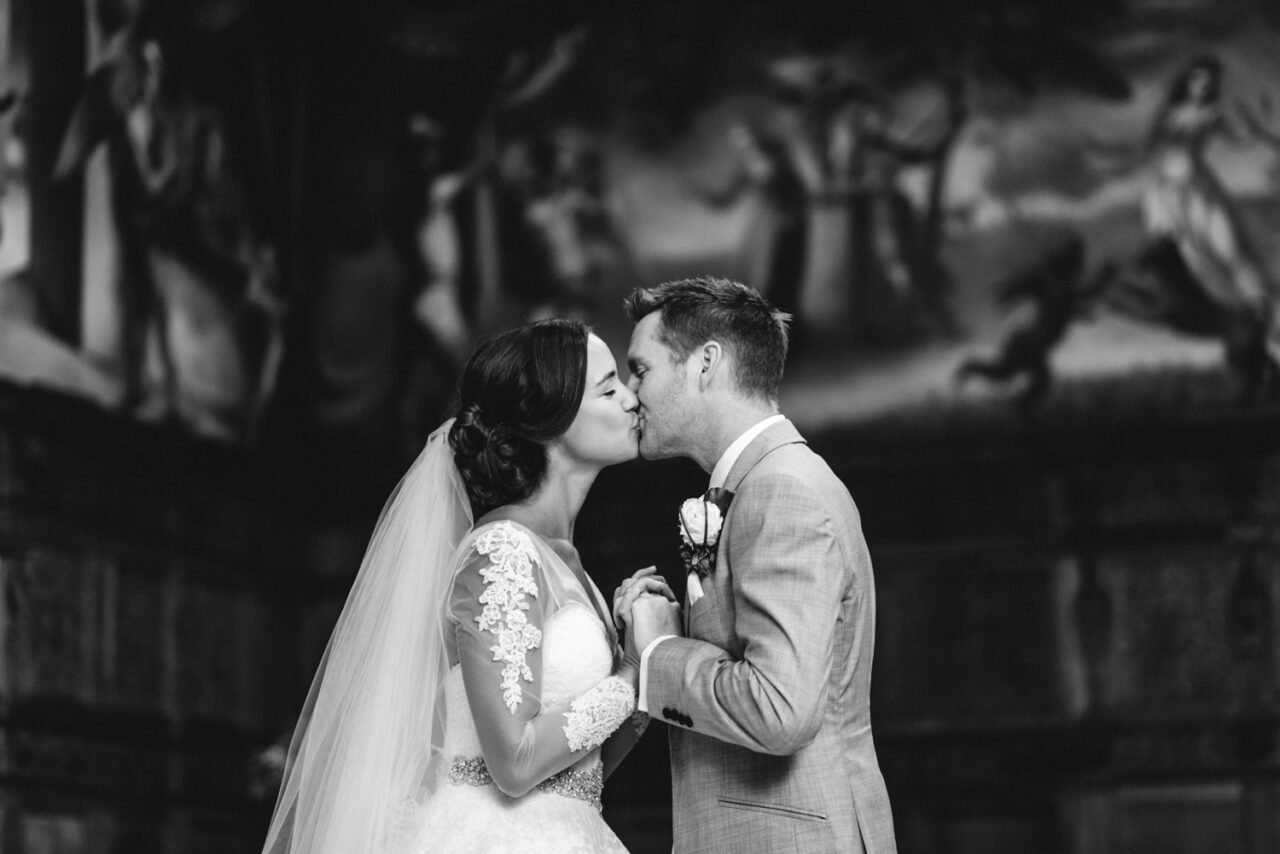 Bride and groom kissing.