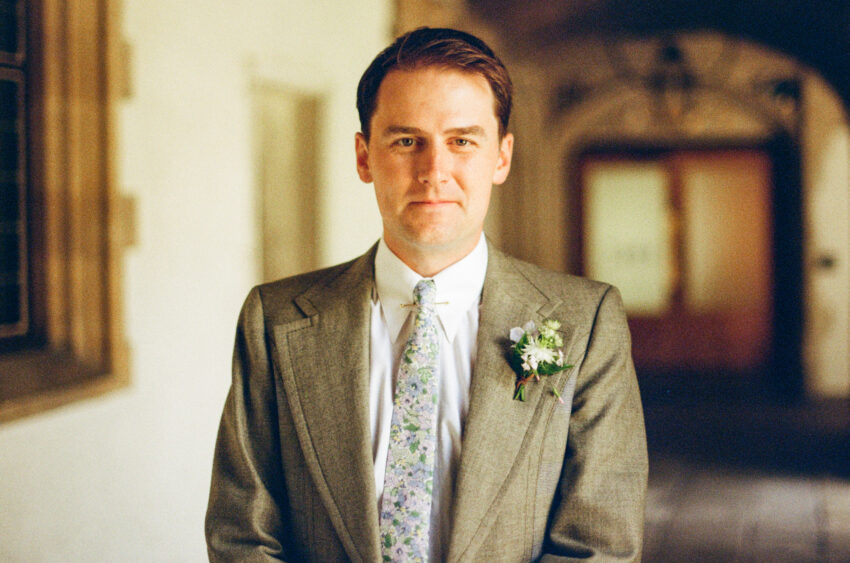 Groom at Jesus College in Cambridge. Photo taken on colour 35mm film.