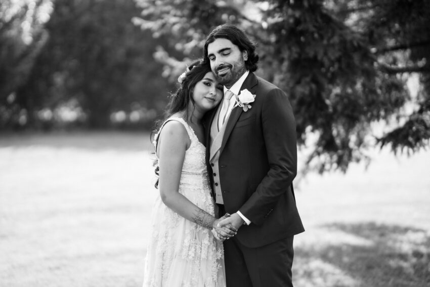 Black and white couple portrait captured by a Lincolnshire wedding photographer, showing a quiet, intimate moment between bride and groom.