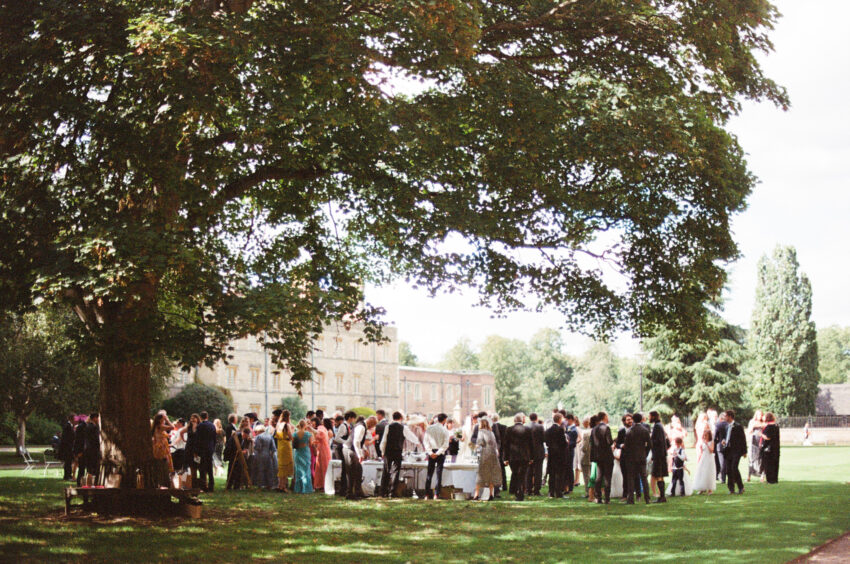Summer wedding reception on the lawn at Jesus College, Cambridge, photographed on 35mm film