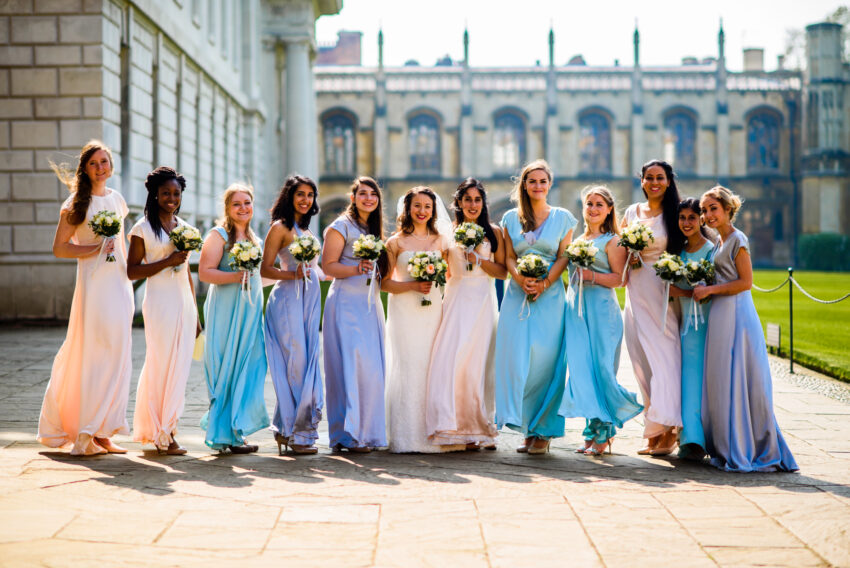 Bridesmaids in pastel dresses outside King’s College
