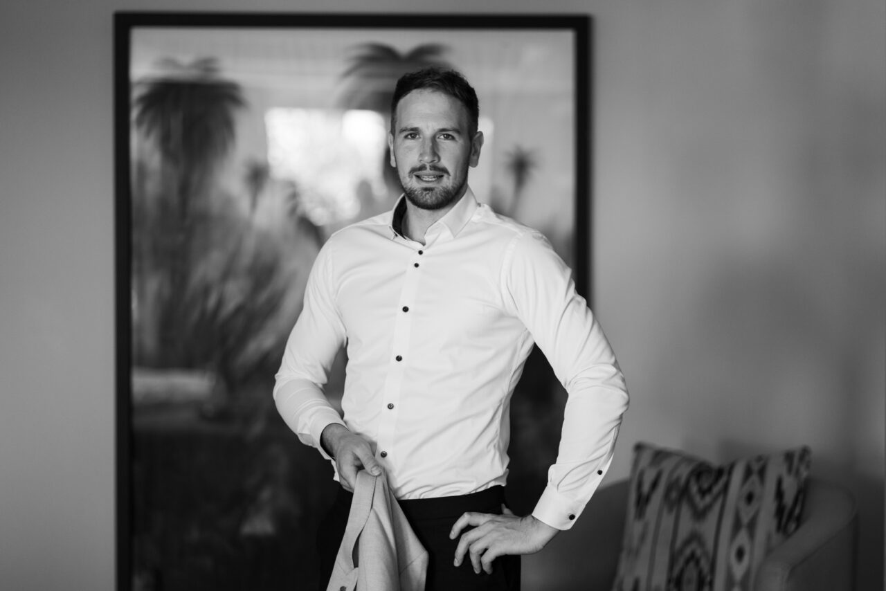 Black-and-white portrait of the groom getting ready before his Marbella wedding