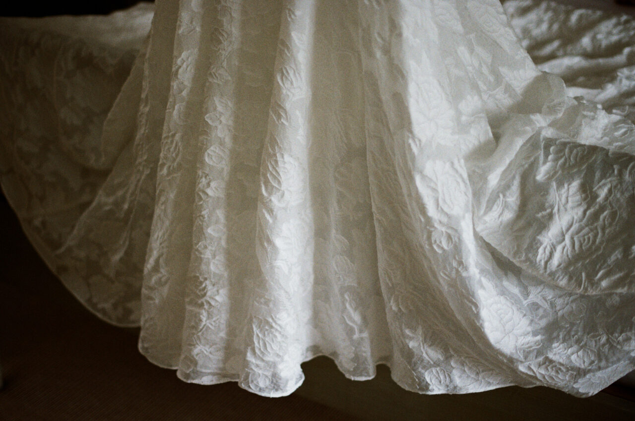 Close-up detail of the wedding dress fabric and train, bridal details in Marbella