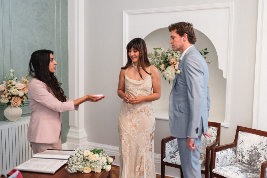 Registrar greeting the couple at a Chelsea Old Town Hall ceremony.