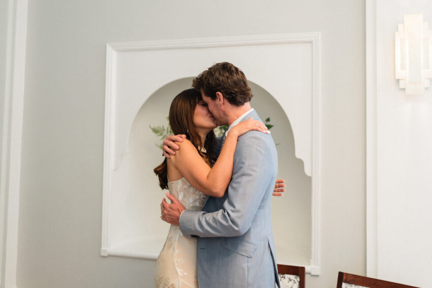 Couple kissing after their Chelsea Old Town Hall ceremony.