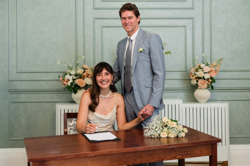 Couple signing the register at Chelsea Old Town Hall.