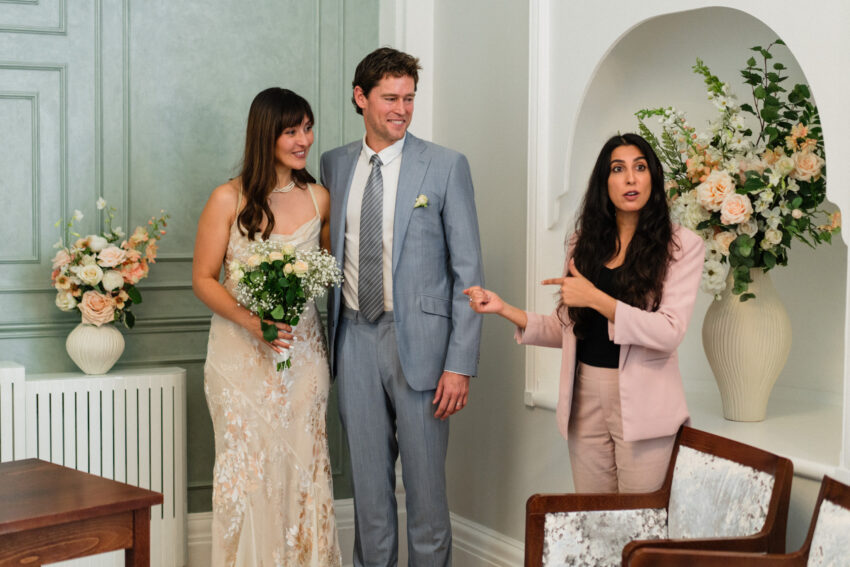 Registrar speaking with the couple after the ceremony at Chelsea Old Town Hall.