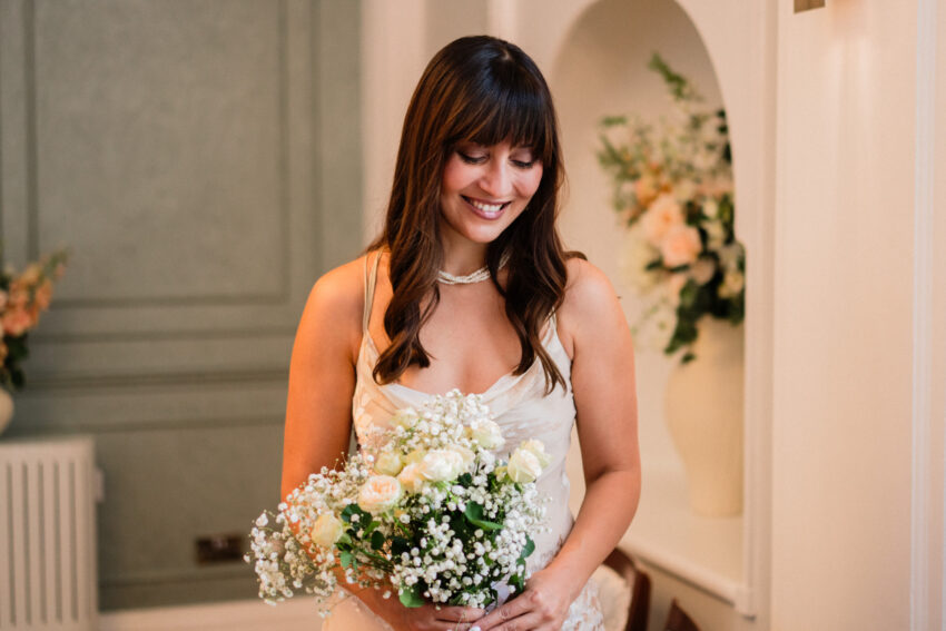Bride holding her bouquet at Chelsea Old Town Hall.