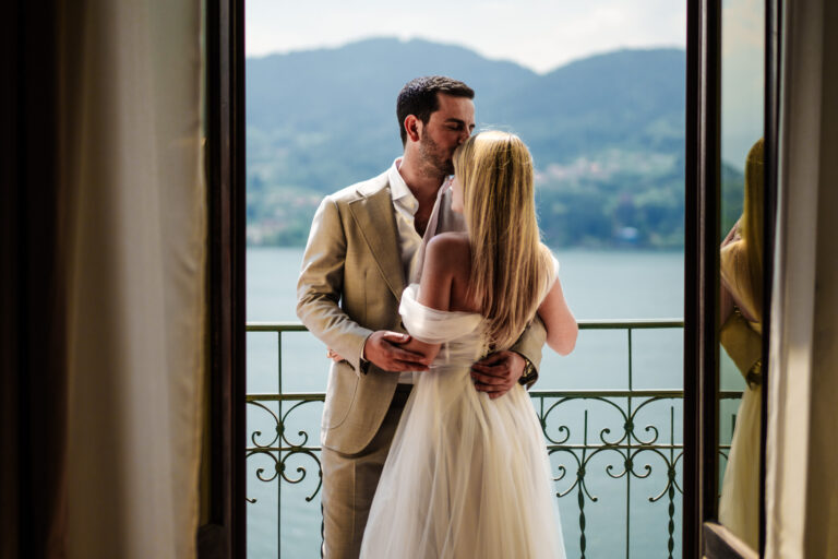 Couple sharing a quiet moment on a balcony of the Grand Hotel Tremezzo.