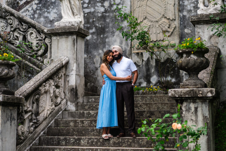 Couple standing together on the steps at Villa Monastero, Lake Como.