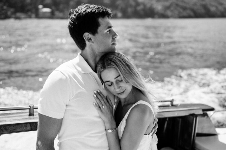 Intimate black and white couple portrait on a boat on Lake Como.