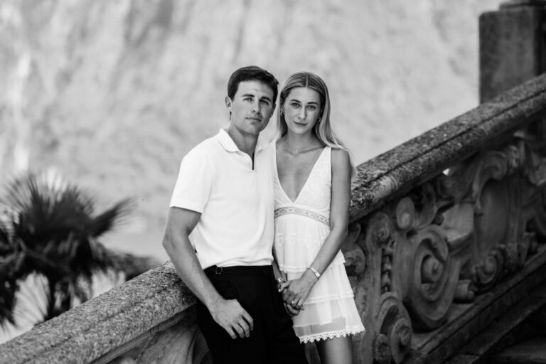 Black and white couple portrait on a stone terrace at Villa del Balbianello, Lake Como.