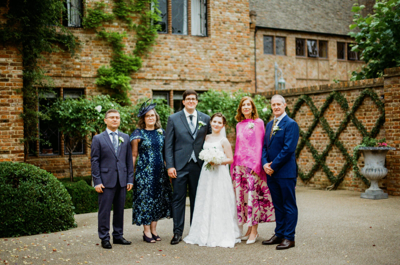 Group photo of guests outside The Old Hall in Ely.