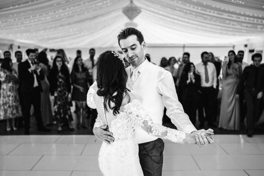 First dance at an Essex wedding, guests gathered closely around.