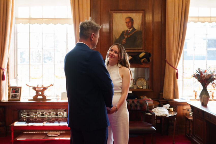 Bride and groom standing together during a quiet moment inside the Mayor’s Parlour before the ceremony.